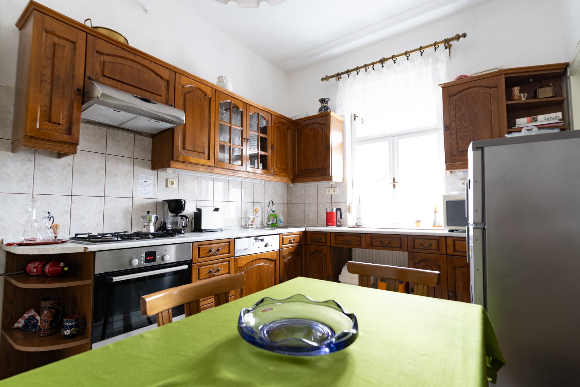 Fully equipped wooden kitchen with a dining table