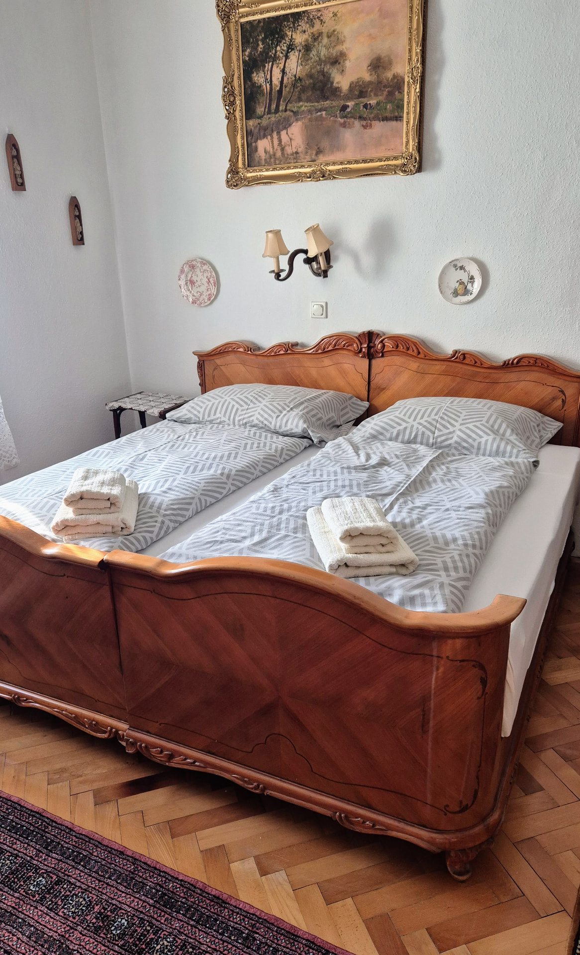 Bedroom with carved antique wooden beds